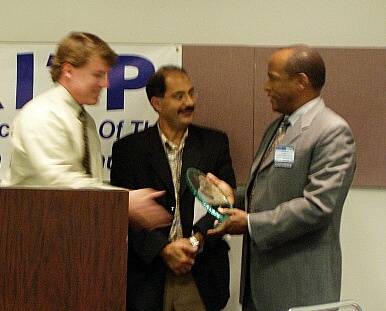 On the right, Fred Mapp, CIO, Advanced Micro Devices, receives his National IT Influence Award from Awards Chairman Scott Calvin and AITP President Bobby Afshin