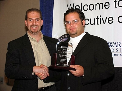 On the right, Tony Alagna, CTO, WholeSecurity is honored as Austin's Information Technologist of the Year by Momentum Software's Scott Campbell